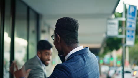 Phone-call,-city-and-black-man-greet-happy