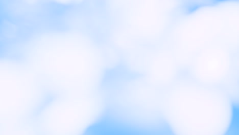 4k. romantic blurry flashing blue bokeh, festive background. new year's or christmas holiday background