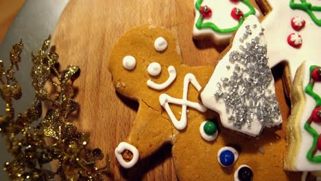 sweet food and gingerbread on wooden plank