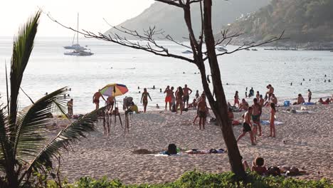 crowd enjoying a sunny day at the beach