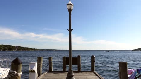 light pole at the end of a pier overlooking the water on a sunny day, no person