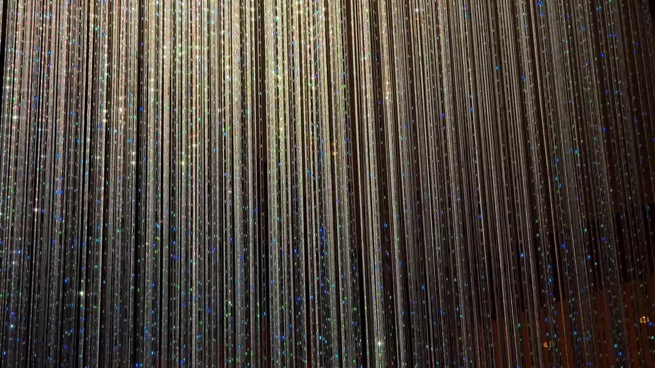 Colorful Sparkling Light Strands Changing Colors on Dark Background