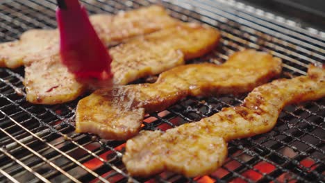 brushing on sauce to pork fillets for mouthwatering, flavorful results