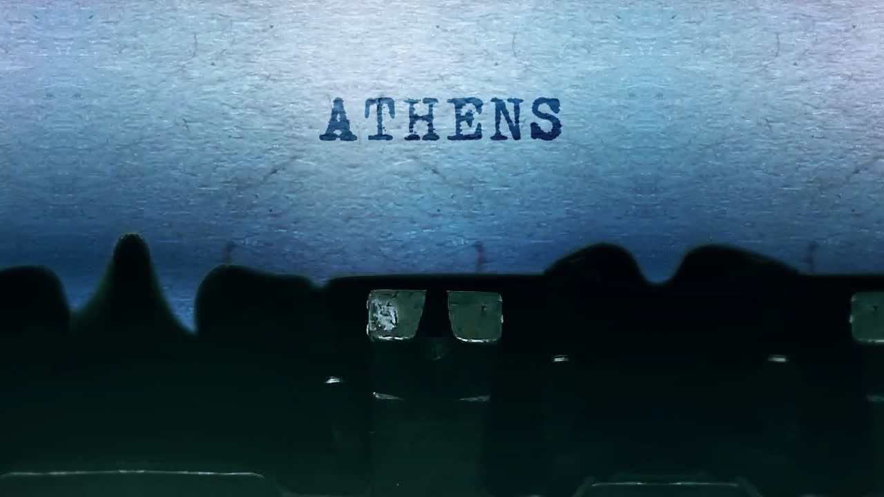 Athens word closeup being typing and centered on a sheet of paper on old vintage typewriter