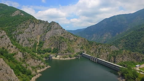 water dam and reservoir lake aerial drone footage in golyam beglik dam - bulgaria