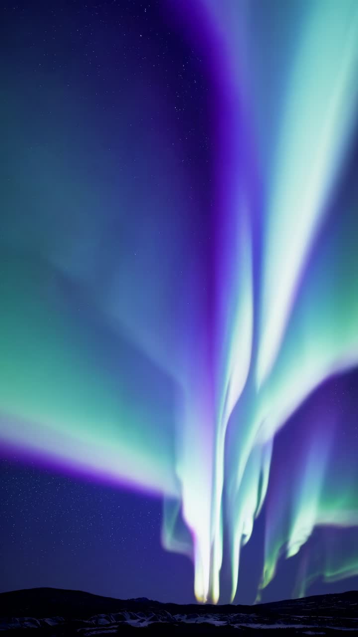 Stunning Aurora Borealis Display Under a Starry Night