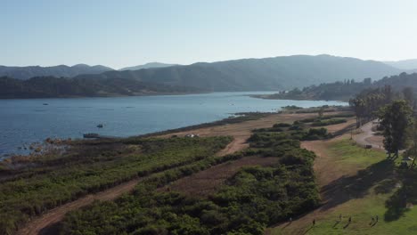 Low-dolly-aerial-shot-of-Lake-Casitas-in-California