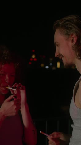 couple smoking at night