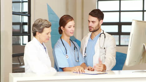 Medical-team-looking-at-documents