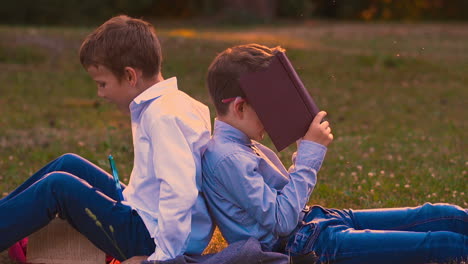 students prepare for difficult exam sitting in school garden