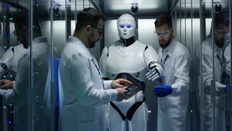 scientists testing a robot in a server room