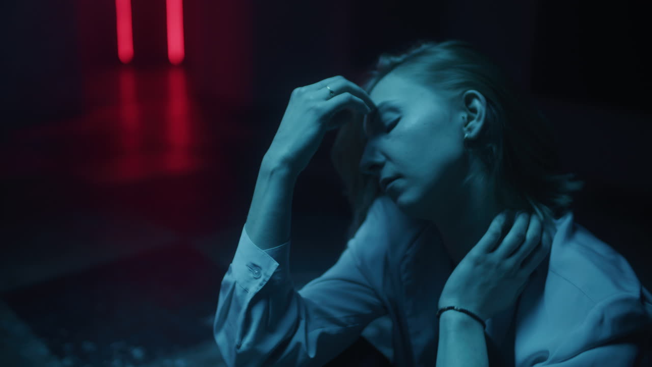 Woman in distress under neon lights