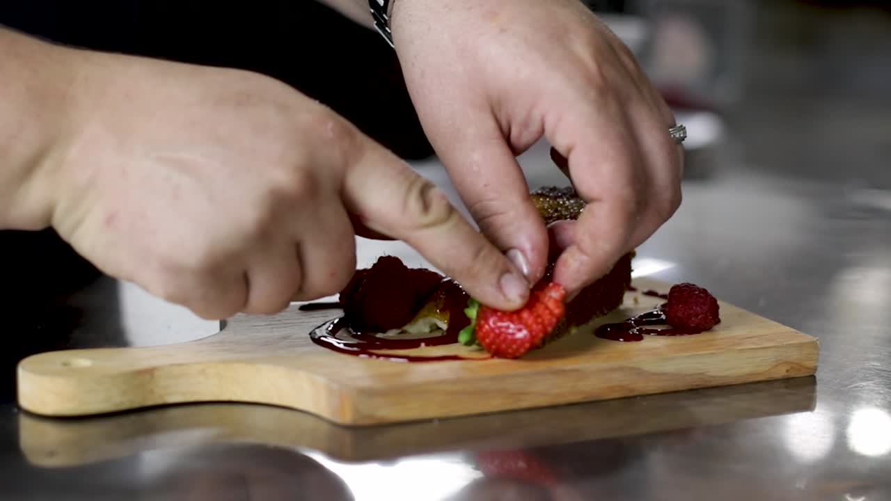 Creme Brulee Cheesecake - Garnished With Sliced Strawberries On A Wooden Board - close up