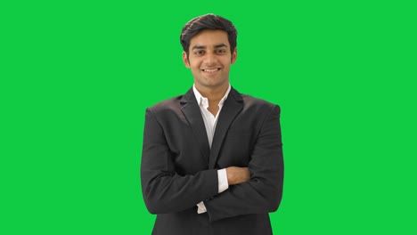 Confident-and-happy-Indian-businessman-standing-with-crossed-hands-Green-screen