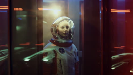 woman in astronaut suit in a futuristic setting