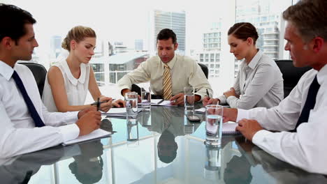 Businessman-talking-to-colleagues