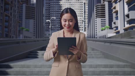 businesswoman using tablet in city