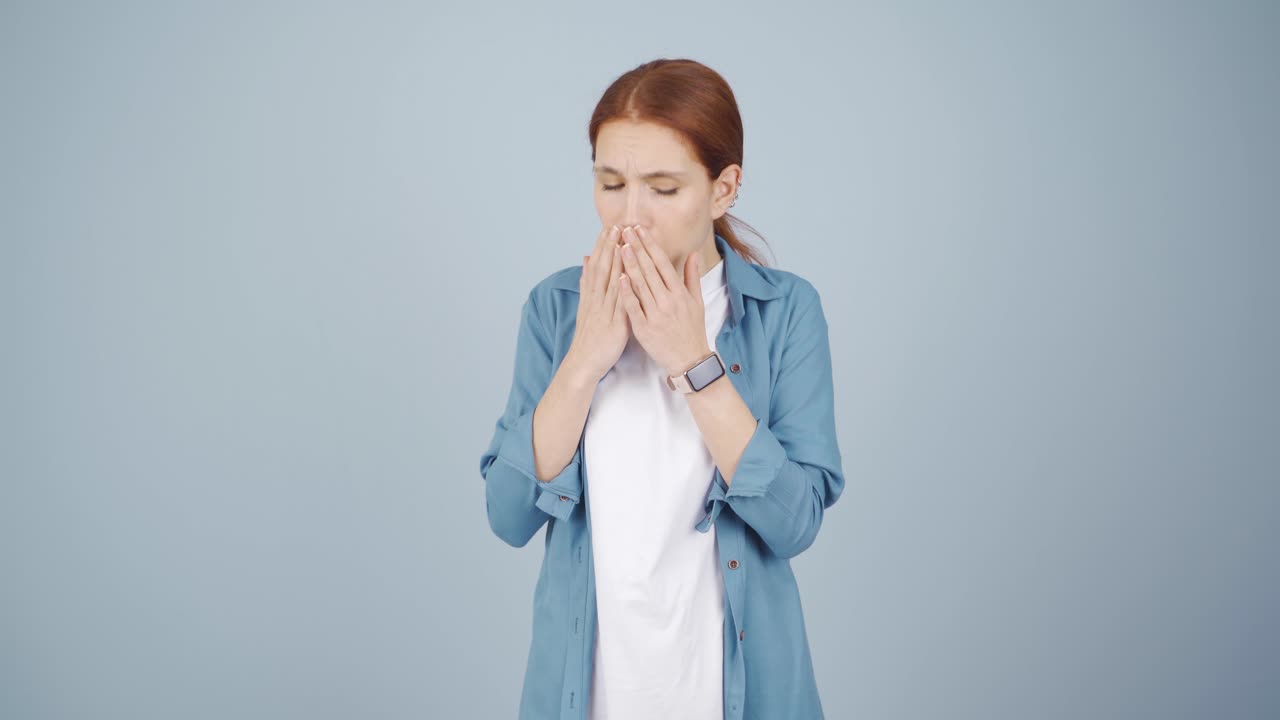 The sick woman can't stop coughing.