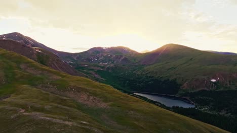 Pan-right,-reveal-Clear-Lake-and-the-Rocky-Mountains-at-Guanella-Pass,-Colorado