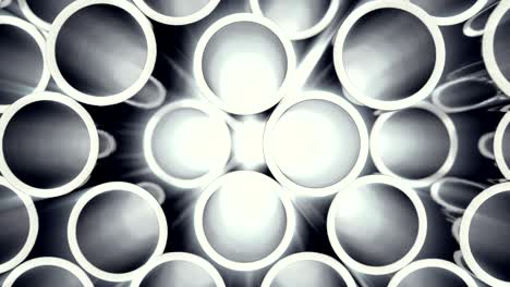 metal pipes stacked. heap of shiny metal steel pipes with selective focus effect.