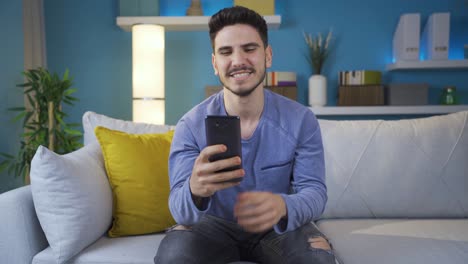 Crazy-and-charismatic-young-man-texting-on-the-phone-with-his-girlfriends.