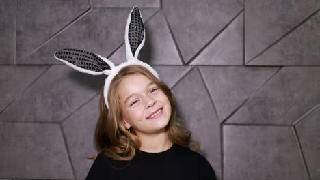 beautiful little girl with bunny ears, happy baby