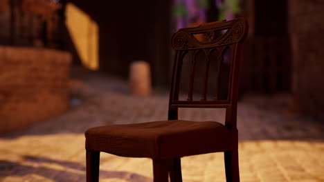 a close up of a dark wooden chair in a dark room