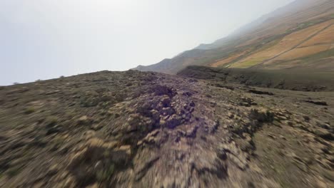 fuerteventura-dry-rocky-mountain-ridge-rise-with-beautiful-view-over-the-green-island