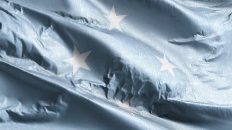 estados federados de micronesia bandera textil ondeando en el bucle del viento. estados federados de micronesia estandarte balanceándose en la brisa. tejido textil de tela. fondo de relleno completo. bucle de 10 segundos.