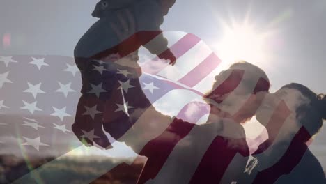 animation of flag of usa over caucasian family at beach