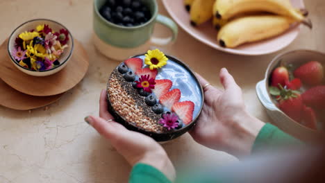 woman, hand and muesli bowl in diet