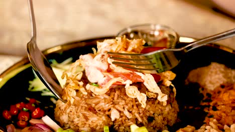 fork lifting shrimp paste fried rice in bangkok