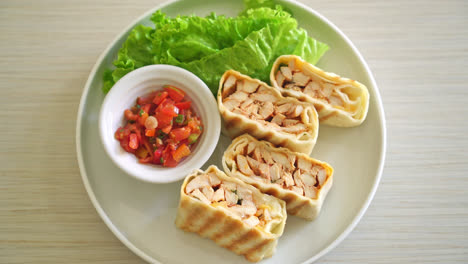 mexican quesadilla chicken - tortilla wrapped chicken and mexican sauce and cheese - mexican food style- mexican food style