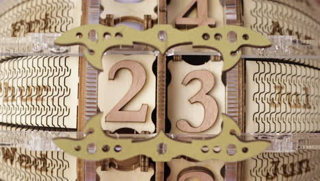 Close-Up-Of-Wooden-Time-Engine-Calendar-Changing-Date