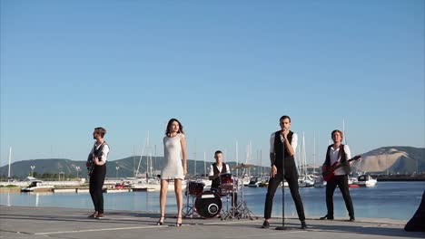 band performing live by the harbor