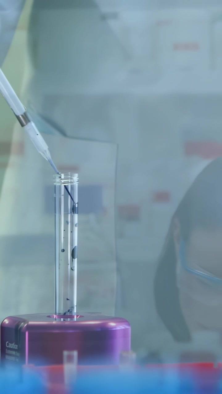 Vertical video: Lab tech lowering pipette into tube on purple rack, animated droplets tracking flow