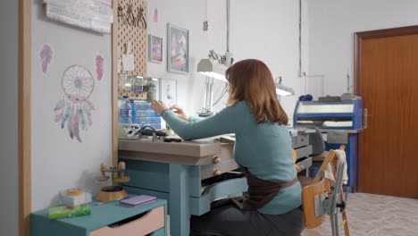 jewelry maker in her workshop