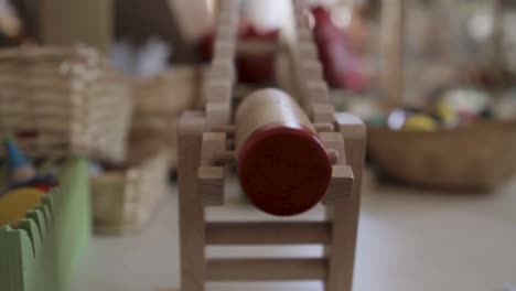 wooden clown toy on a rollercoaster
