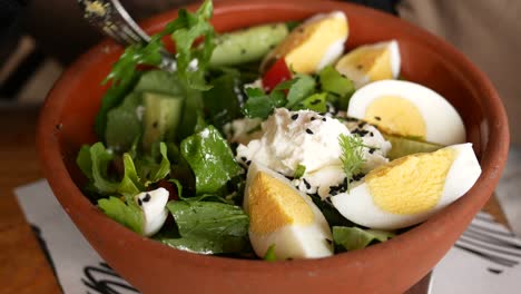 fresh salad with eggs and feta