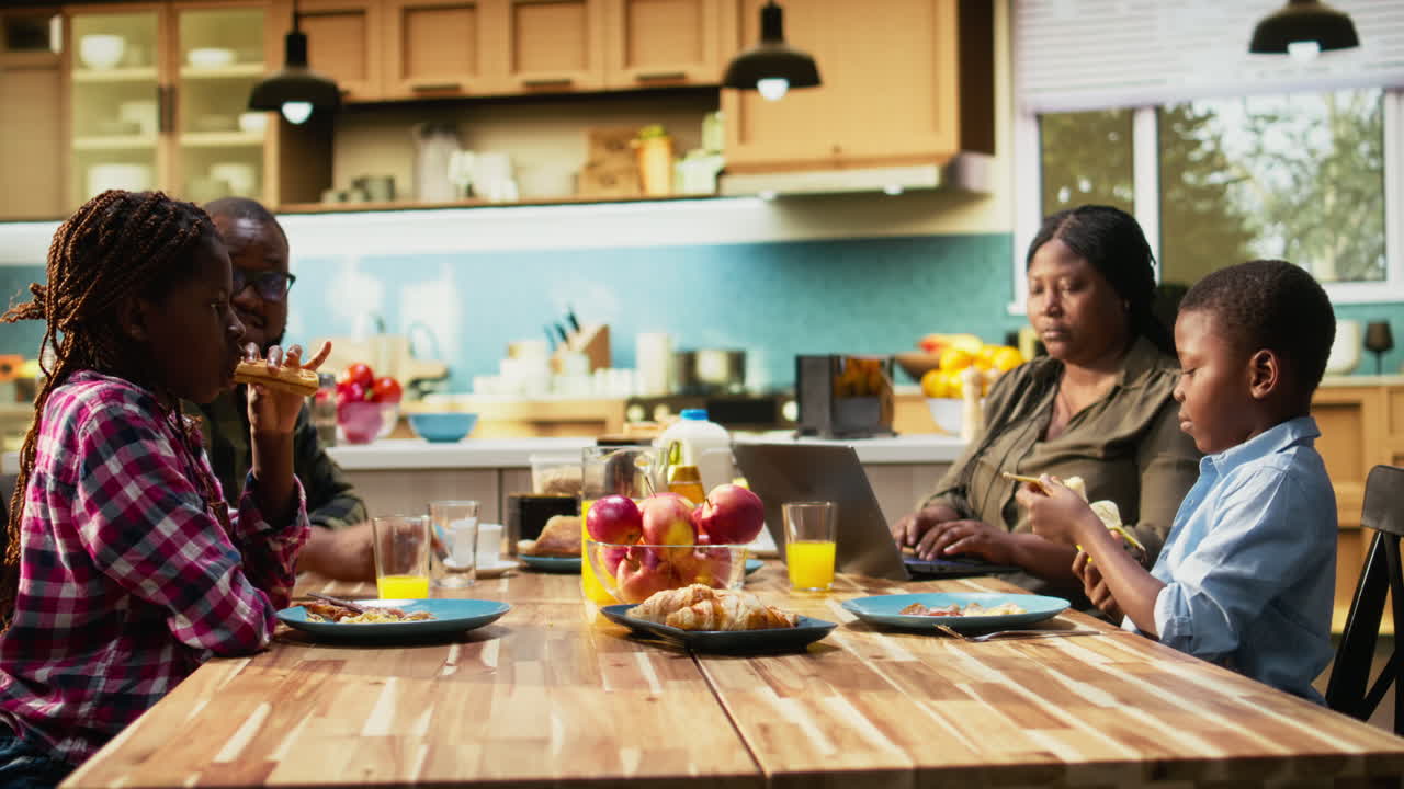 Family enjoying breakfast together in the kitchen