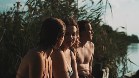 friends relaxing by the river