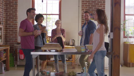 five friends stand talking in kitchen, three quarter length, shot on r3d