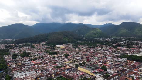 4k aerial drone footage of antigua, guatemala, highlighting the city’s colorful buildings and vibrant streets