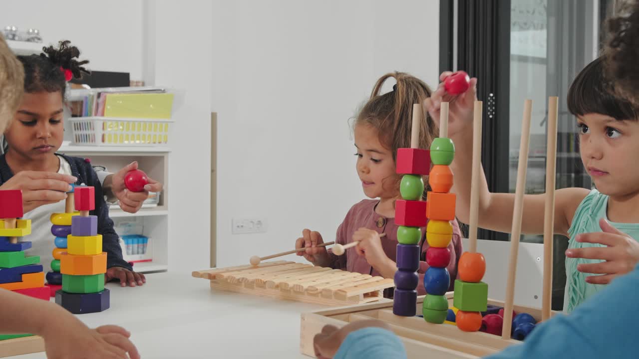 Kids playing with development toys in the kindergarden.