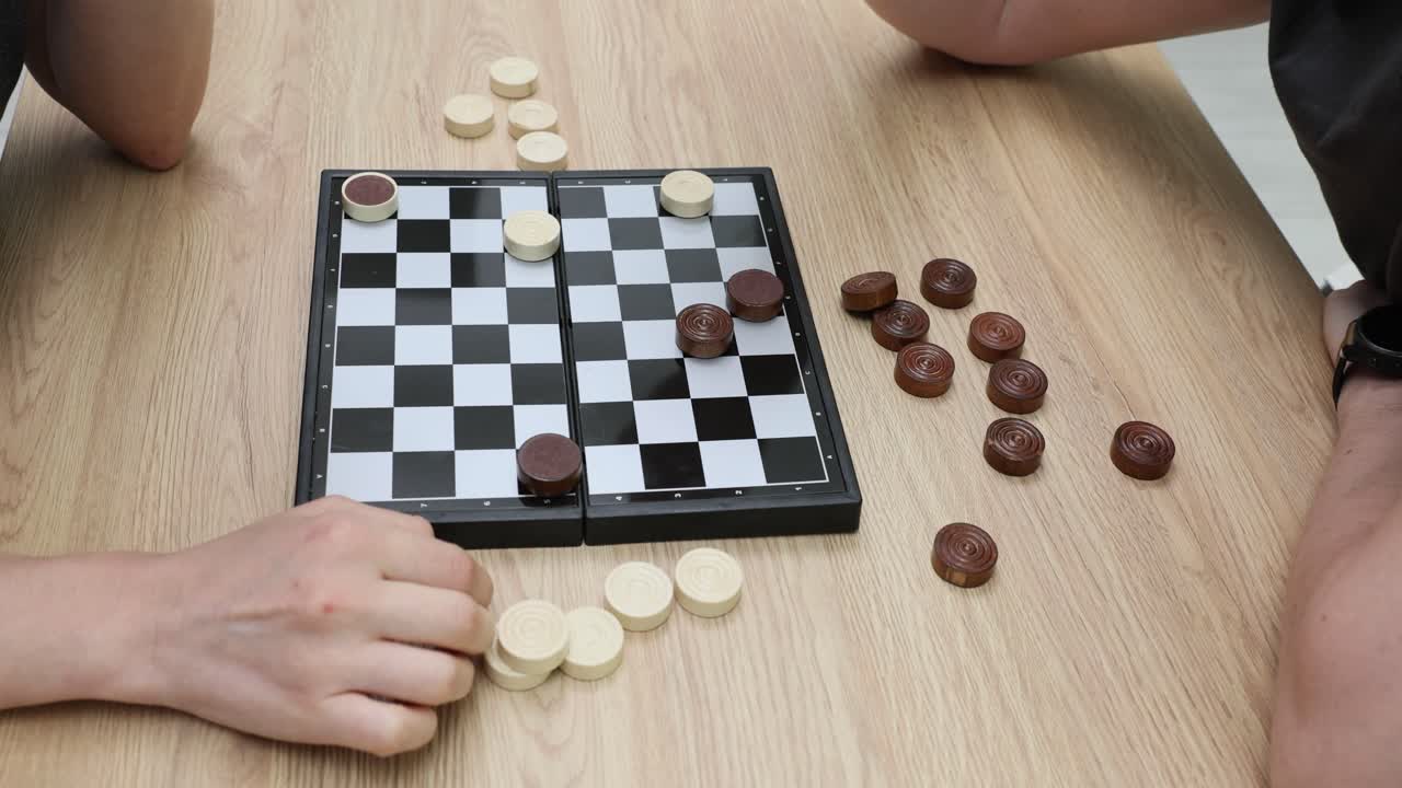 Checkers Game on a Wooden Table