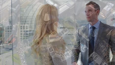 Caucasian-businessman-and-businesswoman-shaking-hands-at-office-against-aerial-view-of-cityscape