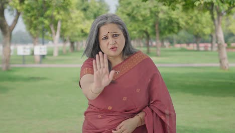 Angry-Indian-old-woman-saying-No-to-someone-in-park