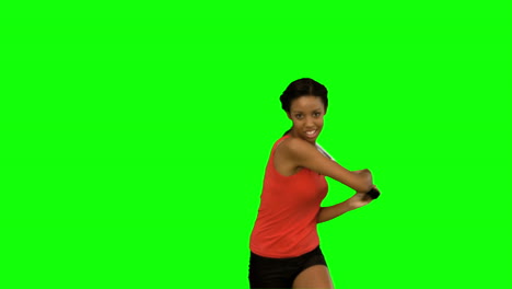 Pretty-woman-playing-tennis-on-green-screen