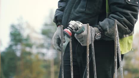 construction worker grinding rebar