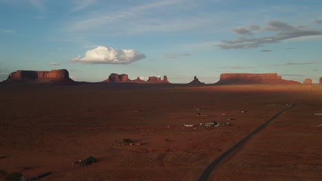 fluffy clouds over monument valley